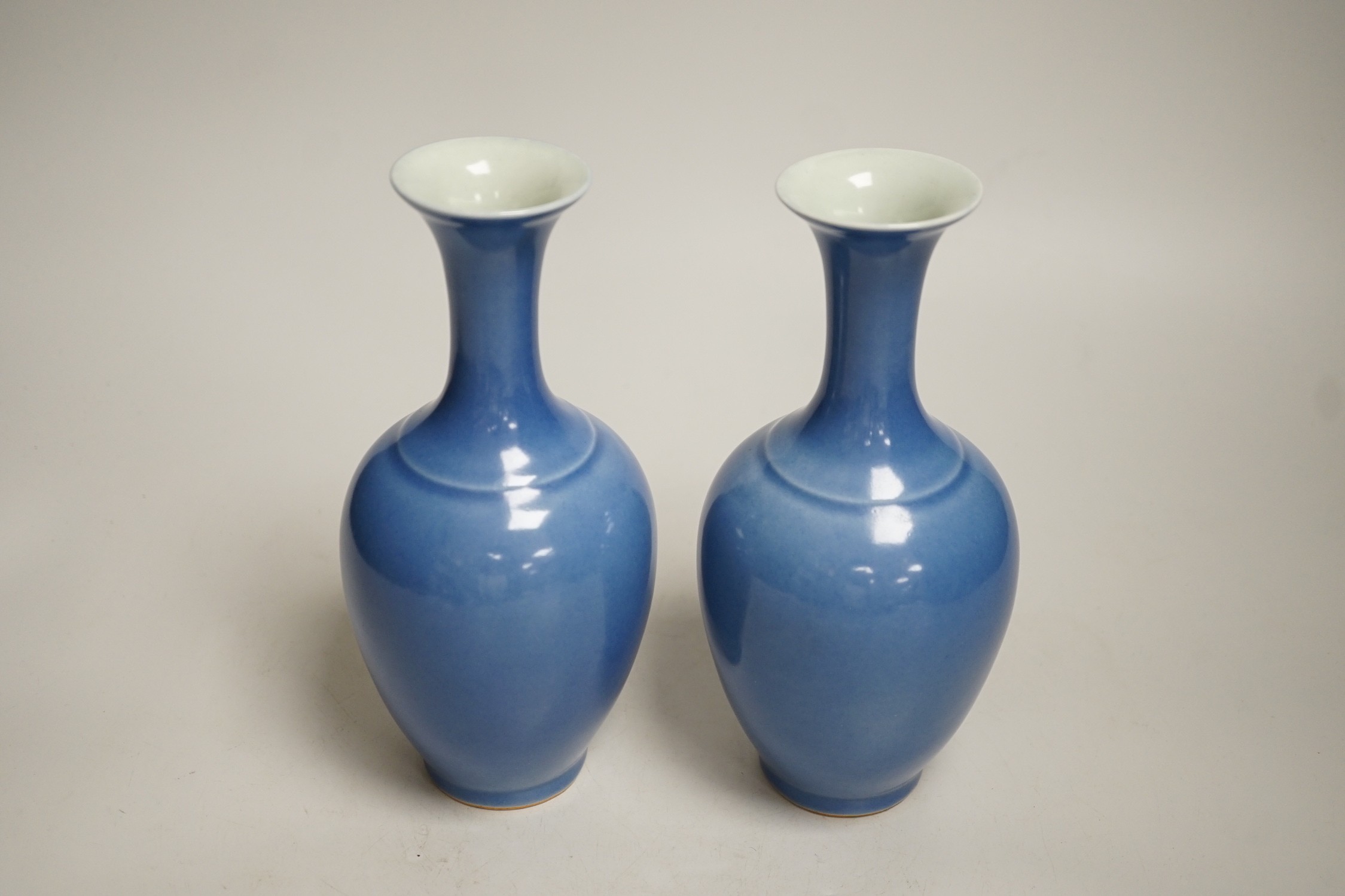 A pair of Chinese blue glazed vases, 21cm